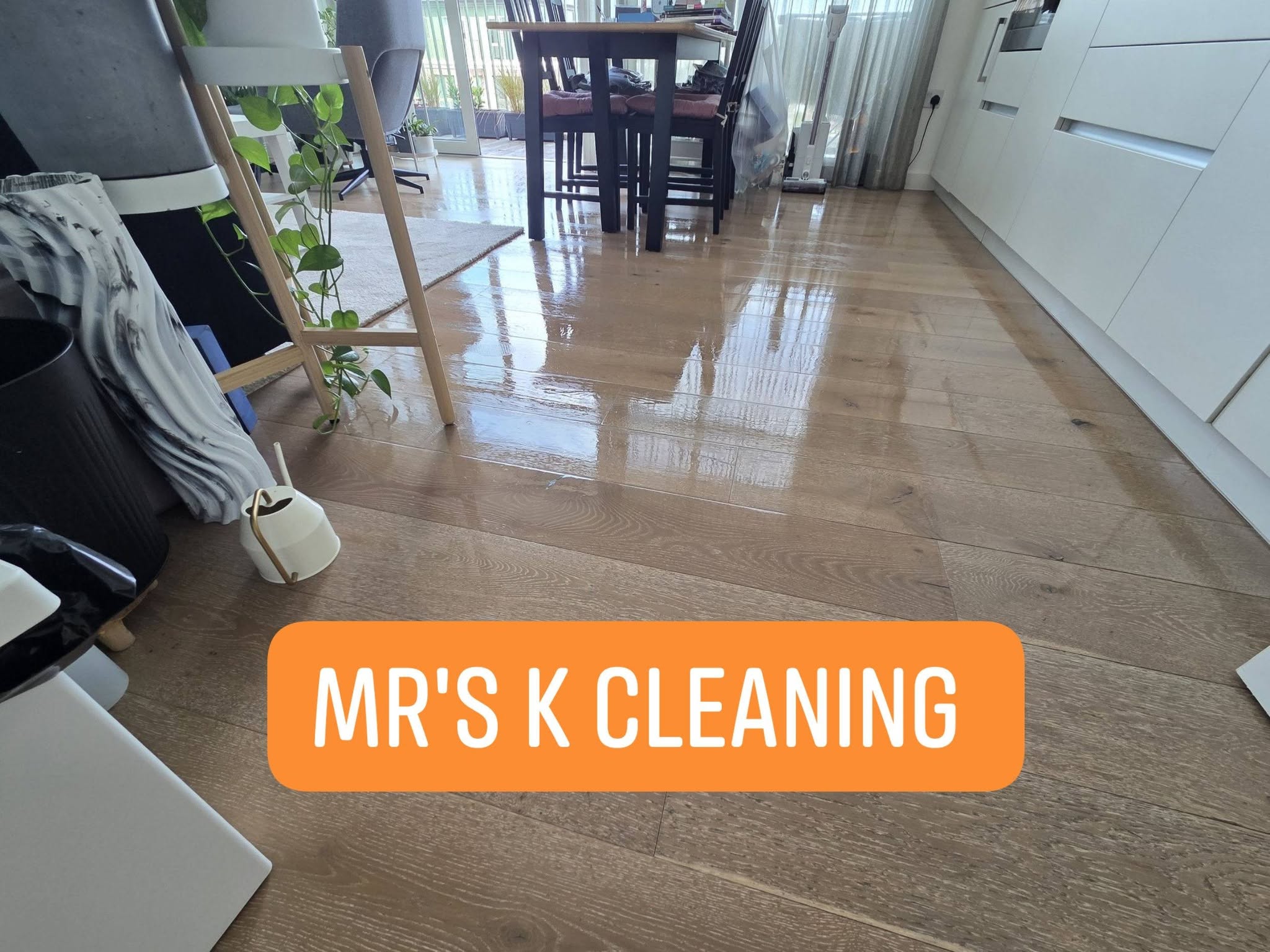 Polished wooden floor with wet shine and reflections