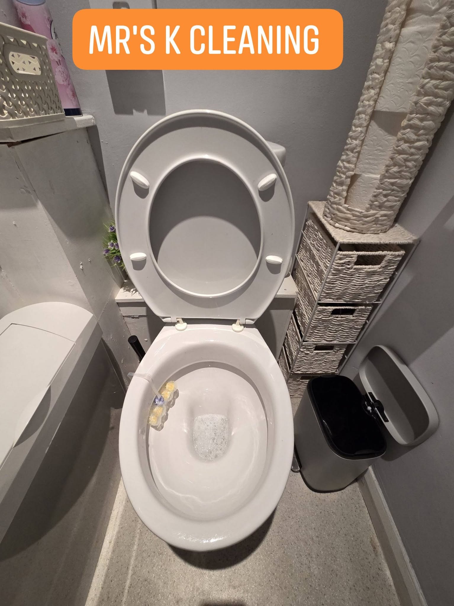 Clean toilet bowl with bathroom interior