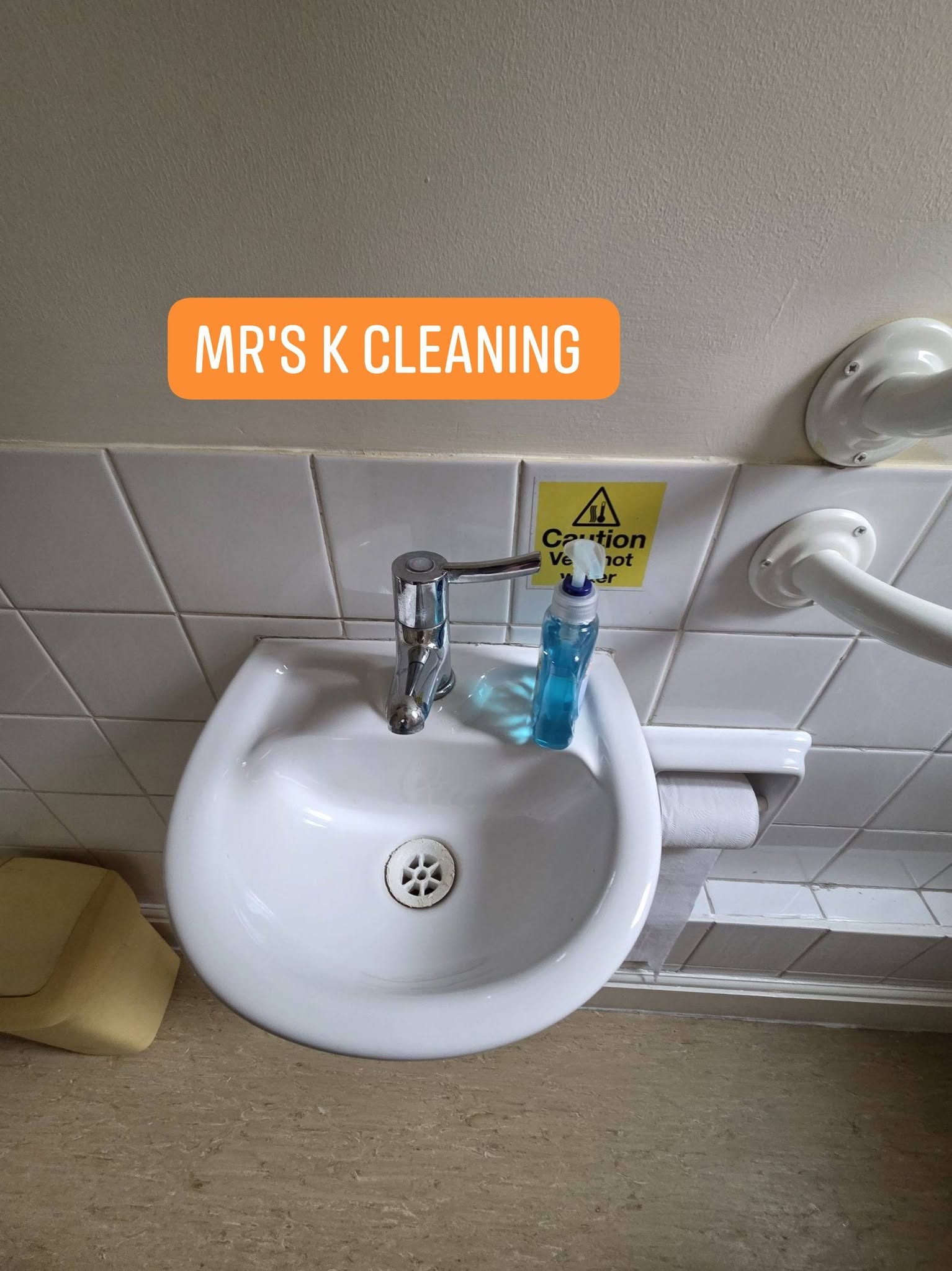 Clean white sink with soap dispenser