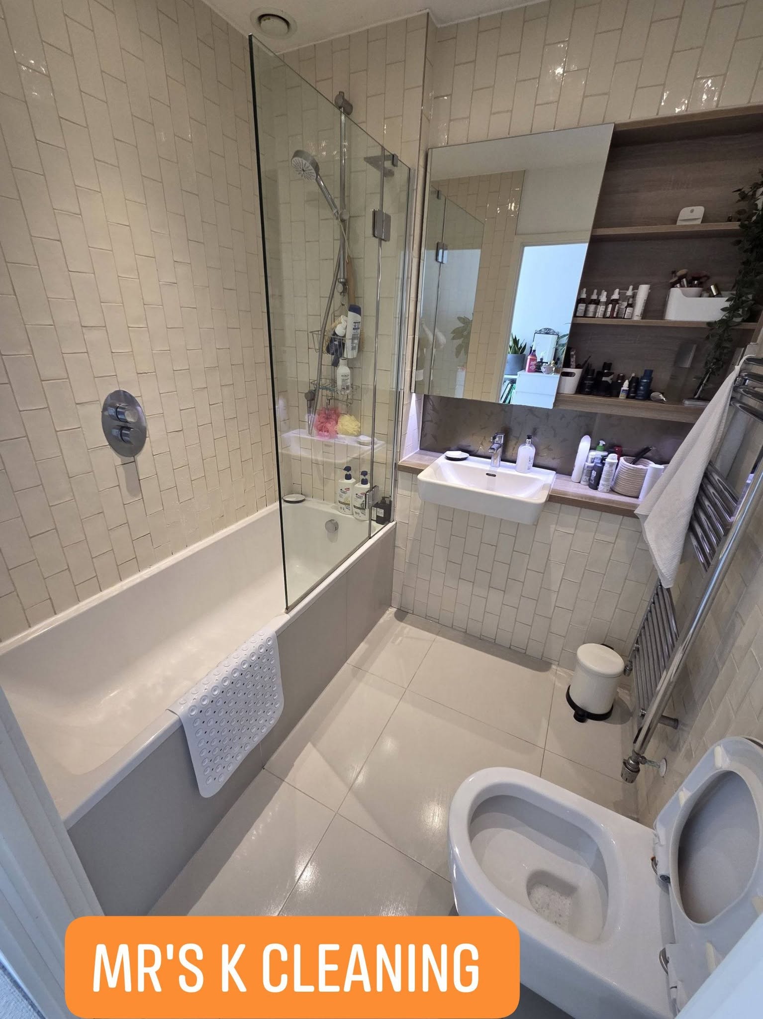 Modern bathroom with white tile walls