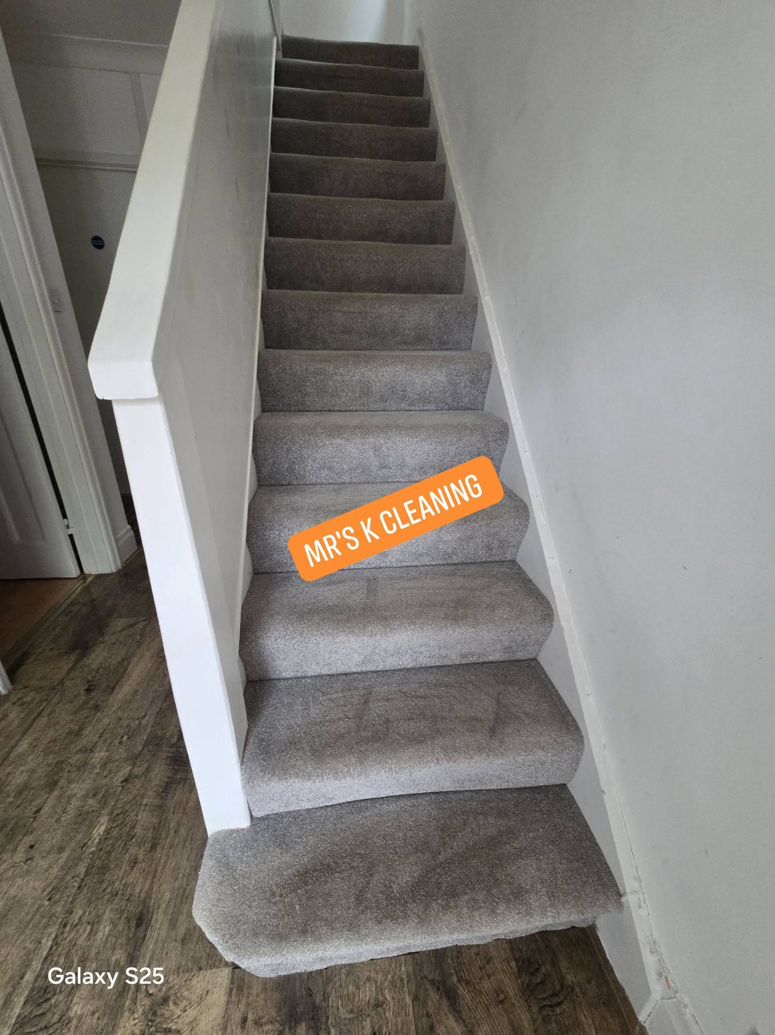 Freshly cleaned grey carpeted staircase