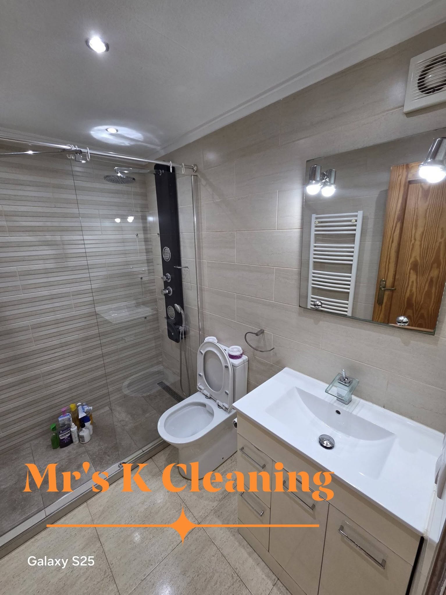Immaculate bathroom with walk in shower, toilet and basin